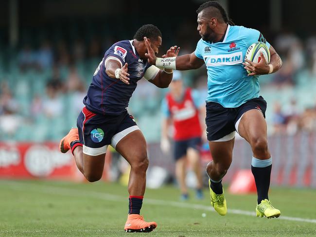The big winger fends off Naivalu.