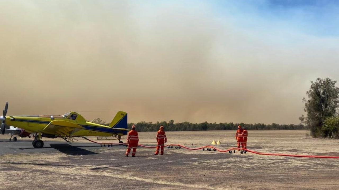 The Bougoure's deliver firefighting foam to fireys at Tara airport as they work to fight the blaze with water bombers. Picture: Sophie Bougoure