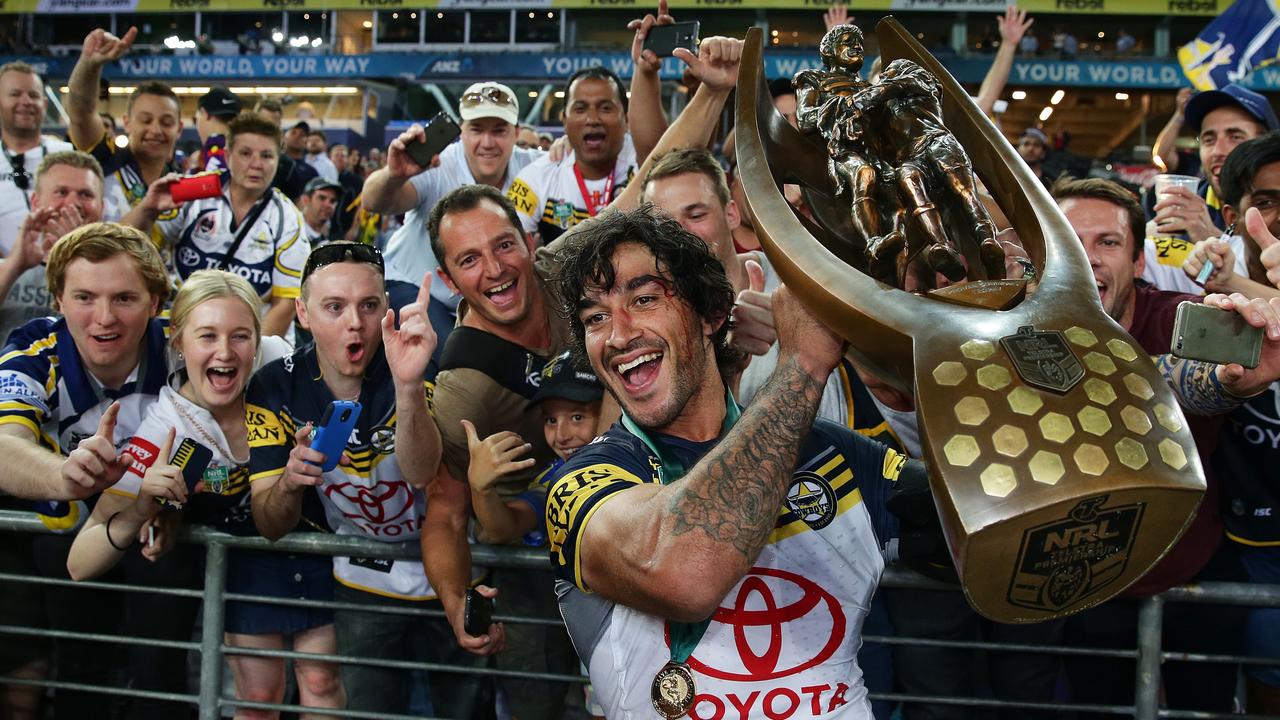 Johnathan Thurston holds the trophy in front of Cowboys fans after the 2015 NRL Grand Final between the Brisbane Broncos and North Queensland Cowboys. Pic Brett Costello