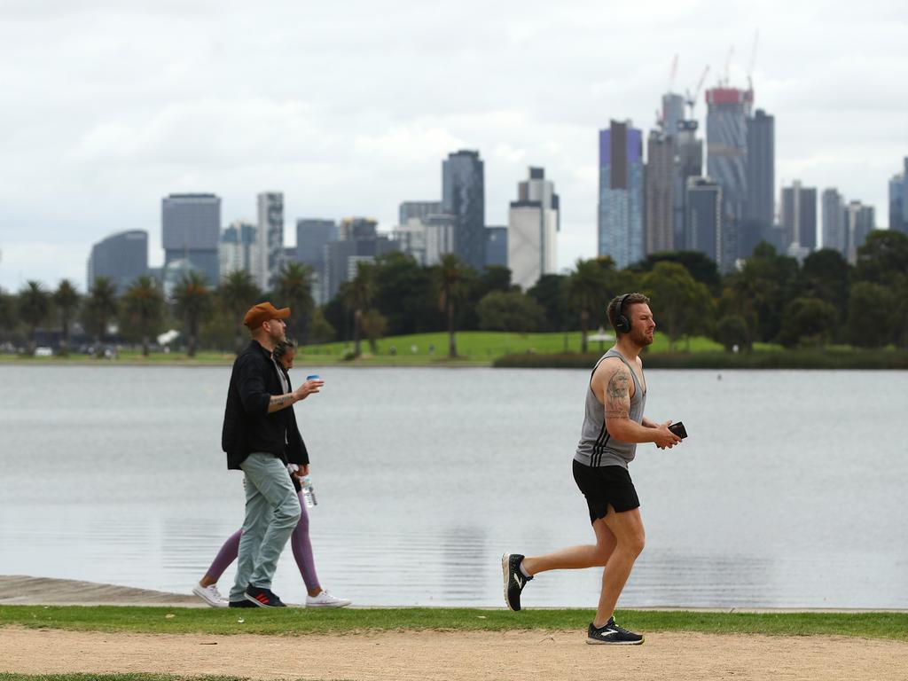 People exercise at Albert Park Lake in February during one of Victoria’s four lockdowns. Picture: Getty Images