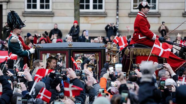 Onlookers cheer as King Frederik X is driven by carriage past the crowd from Christiansborg Castle to Amalienborg Castle in Copenhagen, Denmark. Picture: AFP