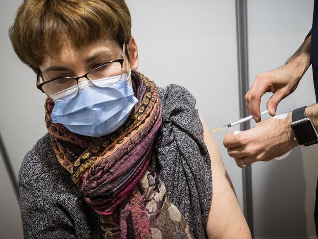 MELBOURNE, AUSTRALIA - MAY 28: A woman receives the AstraZenca vaccine at the Royal Exhibition Building COVID-19 Vaccination Centre on May 28, 2021 in Melbourne, Australia. All Victorians aged 40 and over are eligible to receive either the Pfizer or AstraZeneca COVID-19 vaccines as the Commonwealth COVID-19 vaccination program expands in the state. The vaccine program expansion comes as Victoria enters its first day of a seven-day lockdown following a COVID-19 cluster outbreak in Melbourne's northern suburbs. From midnight, all Victorian residents are subject to stay home orders, and are only allowed to leave home for five reasons: care and caregiving, exercise, work and to buy groceries, or to get vaccinated. The lockdown is effective from 11:59 pm Thursday 27 May to 11:59 pm Thursday 3 June 2021. (Photo by Darrian Traynor/Getty Images)