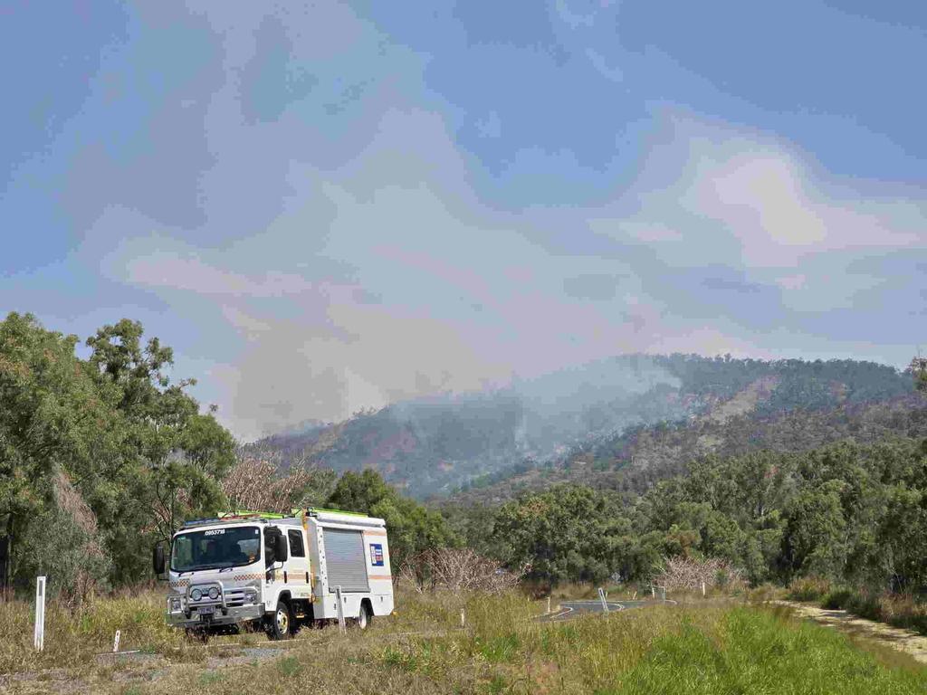 Emergency services at the scene of multiple fires on Mount Morgan range on September 22, 2024. SES have road blocks on the Burnett Hwy as Queensland Fire Brigade crews battle the fires, including using a helicopter to drop water from the air. Photos by Russell Prothero