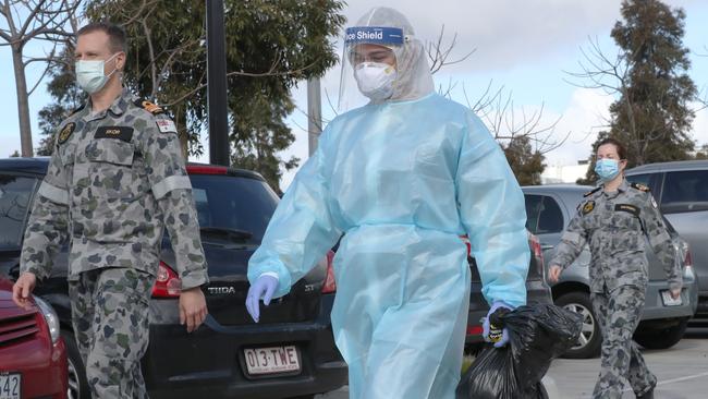 Members of the ADF arrive at Epping Gardens nursing home which has been hit with a large COVID-19 outbreak. Picture: David Crosling