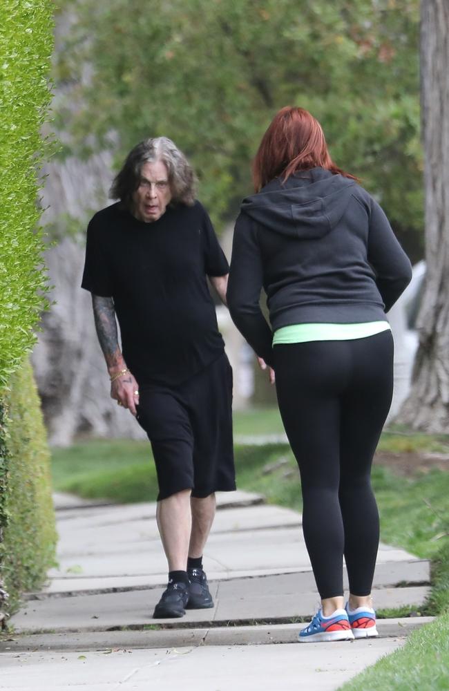 Ozzy Osbourne walked without his cane as he was accompanied by his carer. Pictured: Backgrid