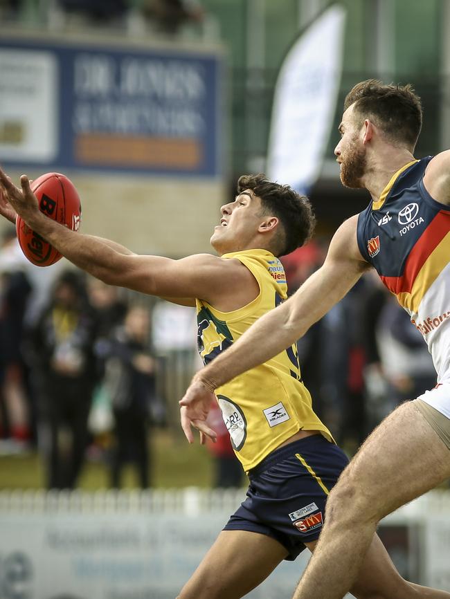 Adelaide's Andy Otten tries to spoil Eagle Liam Martin. Picture: AAP/MIKE BURTON