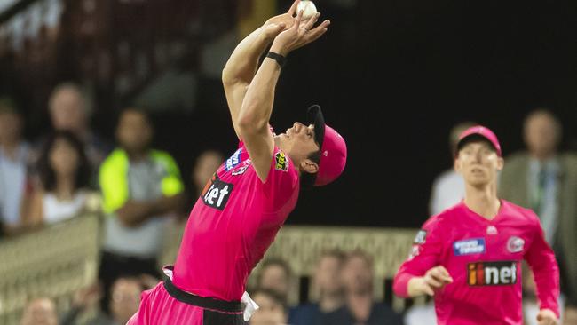 Henriques collects Marcus Stoinis. Photo: AAP Image/Craig Golding