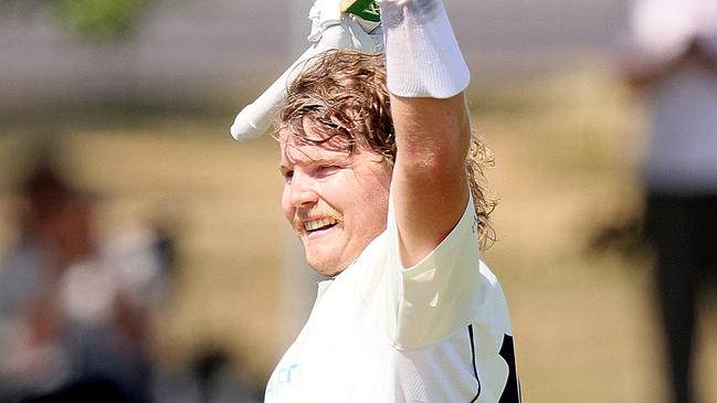 ADELAIDE, AUSTRALIA - NOVEMBER 08: Will Pucovski of Victoria celebrates after reaching his century during day one of the Sheffield Shield match between Victoria and Western Australia at Karen Rolton Oval on November 08, 2020 in Adelaide, Australia. (Photo by Daniel Kalisz/Getty Images)