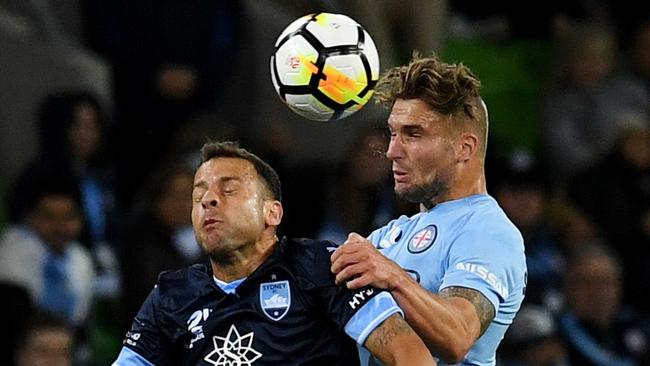 Melbourne City’s Bart Schenkeveld (right) and Sydney FC’s Bobo compete for the ball on Friday night.