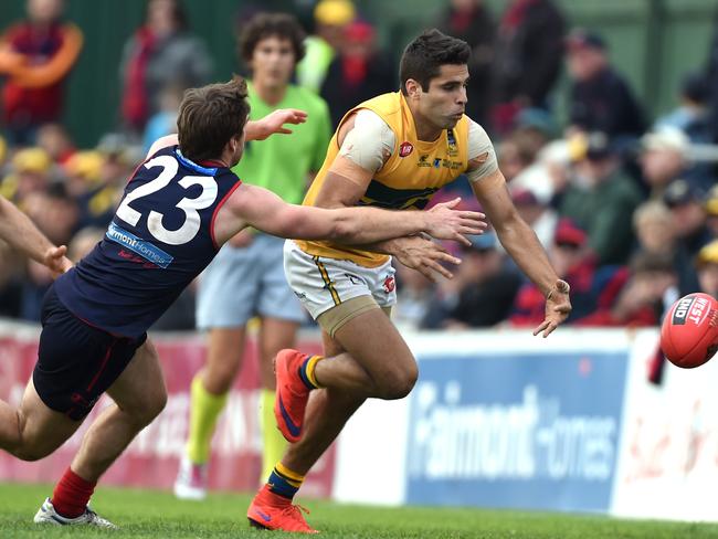 Eagle Jared Petrenko leads Norwood's Timothy Webber for the ball. Photo: Tom Huntley