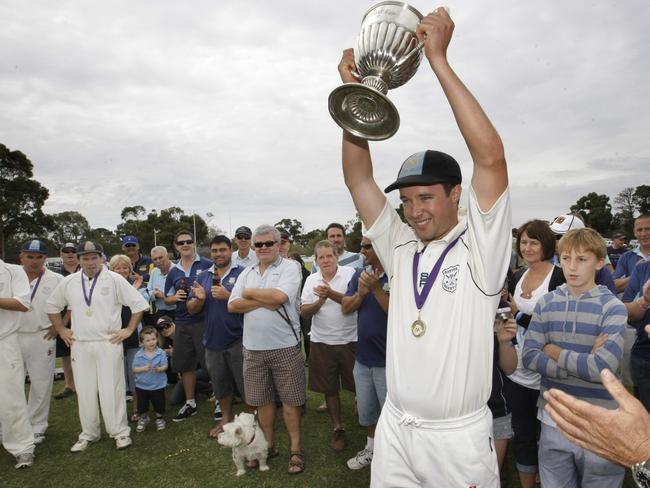 Baxter captain Daniel Warwick hoists the 2009-10 MPCA Provincial premiership cup.