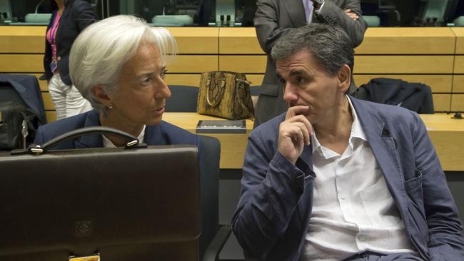 Greek Finance Minister Euclid Tsakalotos, right, speaks with IMF chief Christine Lagarde in Brussels.