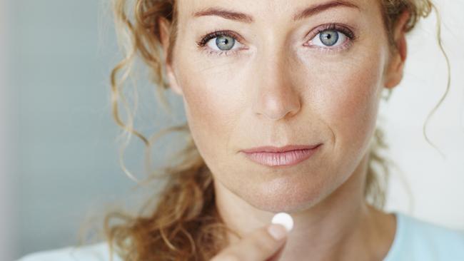 Generic photo of a woman taking a tablet / medicine. Picture: iStock