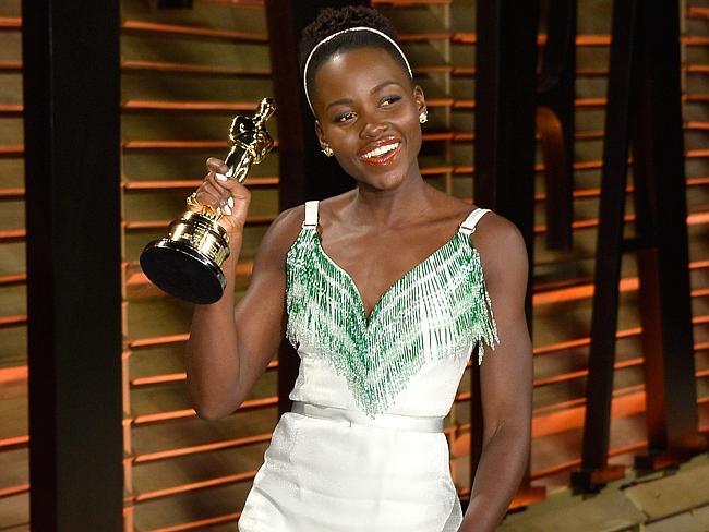 All smiles ... Lupita Nyong'o attends the 2014 Vanity Fair Oscar party.