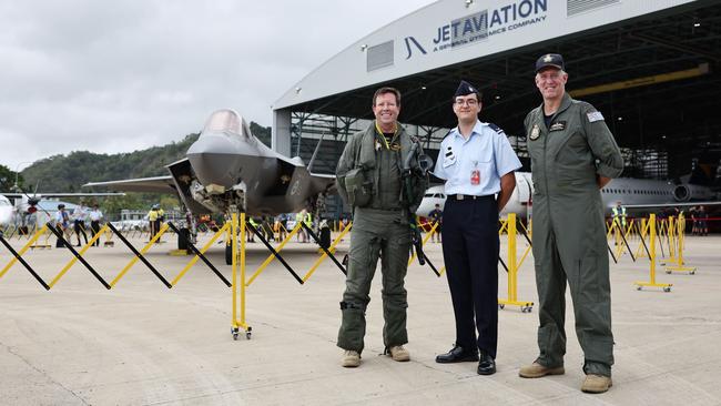 The Royal Australian Air Force has flown a Lockheed Martin F-35 Lightning II strike fighter jet to Cairns, the first time one of the air force's fifth generation fighter jets has visited Far North Queensland. Wing Commander Phil Eldridge, Air Force cadet instructor Oliver Roper and Group Captain Stewart Dowrie in front of the F-35 Lightning II at the Cairns International Airport. Picture: Brendan Radke