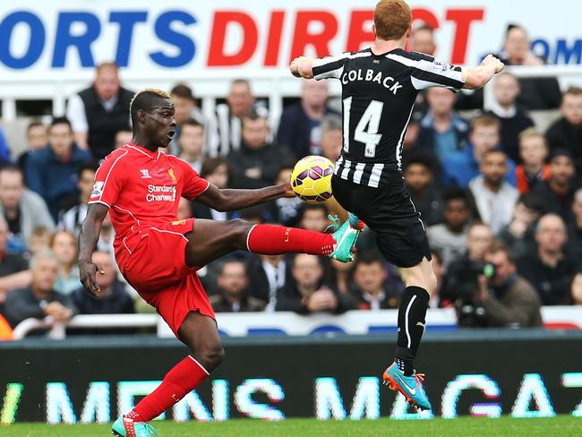 Liverpool's striker Mario Balotelli (left) vies with Newcastle United's midfielder Jack Colback. Picture: AFP/Ian MacNicol