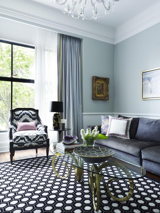 A chair upholstered in Kelly Wearstler fabric is a focal point in this room but starting point for this design was the grey lounge and dove grey walls.