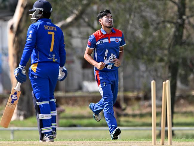 Footscray United’s Frank Hoang bowls Sachin Noragal of Grand United. Picture: Andy Brownbill