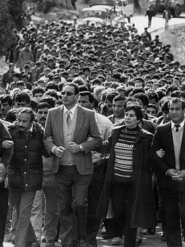 1986 photo of PLO spokeswoman Hanan Ashrawi (2nd from R) leading a Birzeit University march.