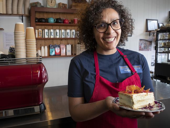 Little Miss Patisserie manager Denise Shukri holds a piece of vanilla slice at Hobart. Picture: Chris Kidd