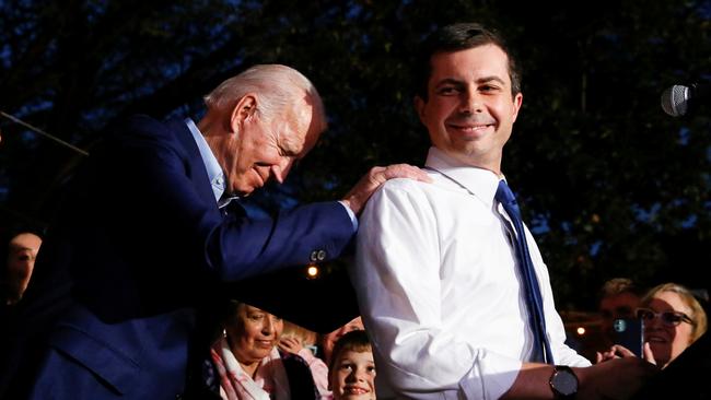 Joe Biden reacts as Pete Buttigieg endorses the former vice preisdent for the Democratic nomination in Dallas. Picture: Reuters