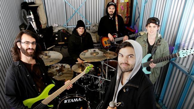 Hard workers ... Northlane rehearse in a tiny storage unit in Penrith. Picture: Peter Kelly.