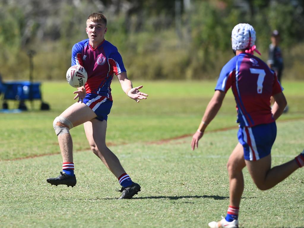 Boys Rugby League State Championship held at Northern Division, Brothers Leagues ground, Townsville. 16-18 years. Peninsula (stripe) v Darling Downs (blue/purple). Bodhi Sharpely of St Mary's College, Toowoomba.