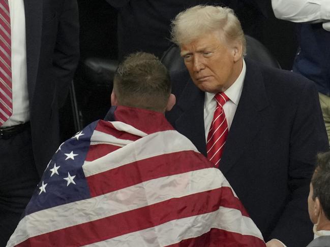 Wrestler Wyatt Hendrickson talks to President Trump during the 2025 NCAA Division I Men's Wrestling Championship. Picture: Getty Images via AFP