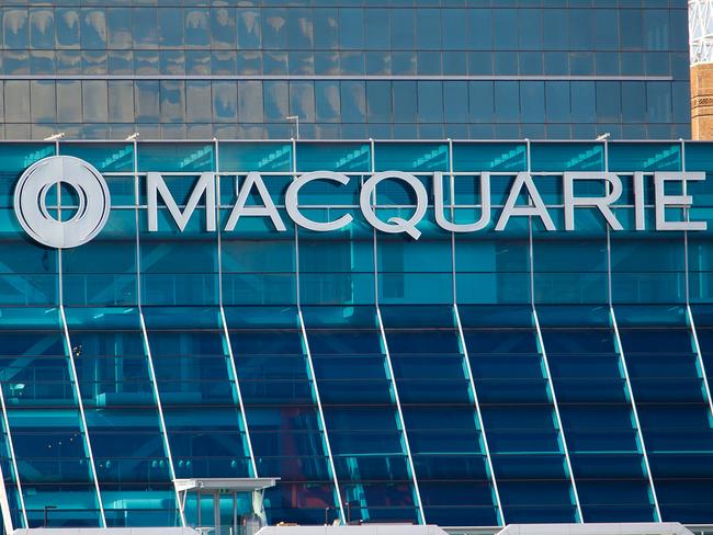 The Macquarie Group Ltd. logo is displayed on the facade of the Macquarie Group Building in Sydney, Australia, on Friday, April 27, 2012. Macquarie Group Ltd., Australia's largest investment bank, said it's relying on cost cuts to revive earnings after a slump in trading income and dealmaking dragged full-year net income to an eight-year low. Photographer: Ian Waldie/Bloomberg