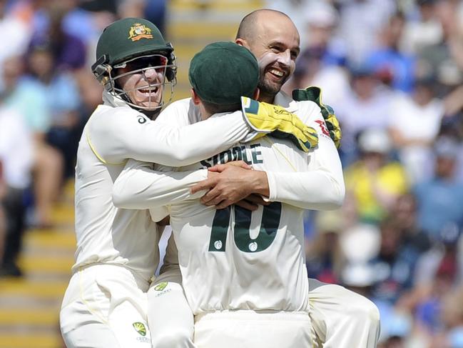 Australia's Nathan Lyon, right, celebrates with teammates after dismissing England captain Joe Root during day five of the first Ashes Test cricket match between England and Australia at Edgbaston in Birmingham, England, Monday Aug. 5, 2019. (AP Photo/Rui Vieira)