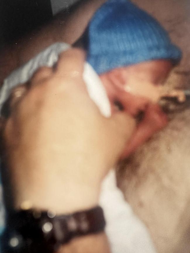 Little James, who was born at 23 weeks, on the chest of his dad Paul Thewlis when he was about three weeks old. Picture: Supplied