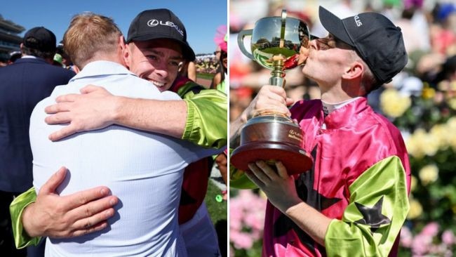 Robbie Dolan gets a hug from Ronan Keating and kisses the Melbourne Cup. Pictures: Getty Images