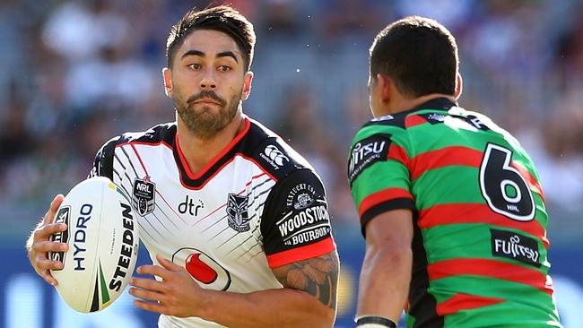 Shaun Johnson runs the ball for the Warriors against the Rabbitohs.