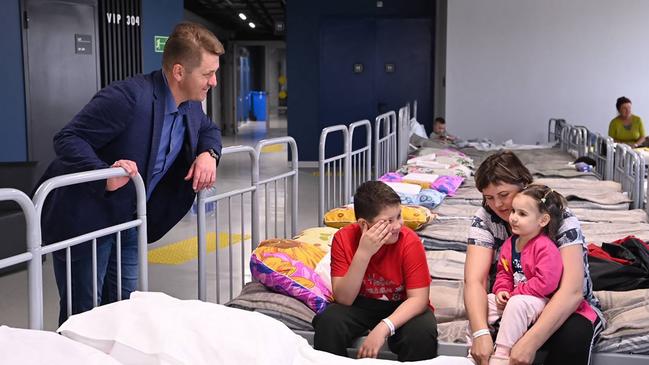 Belgorod mayor Valentin Demidov visits a temporary shelter for residents evacuated from the town of Shebekino. Picture: AFP/Telegram Handout