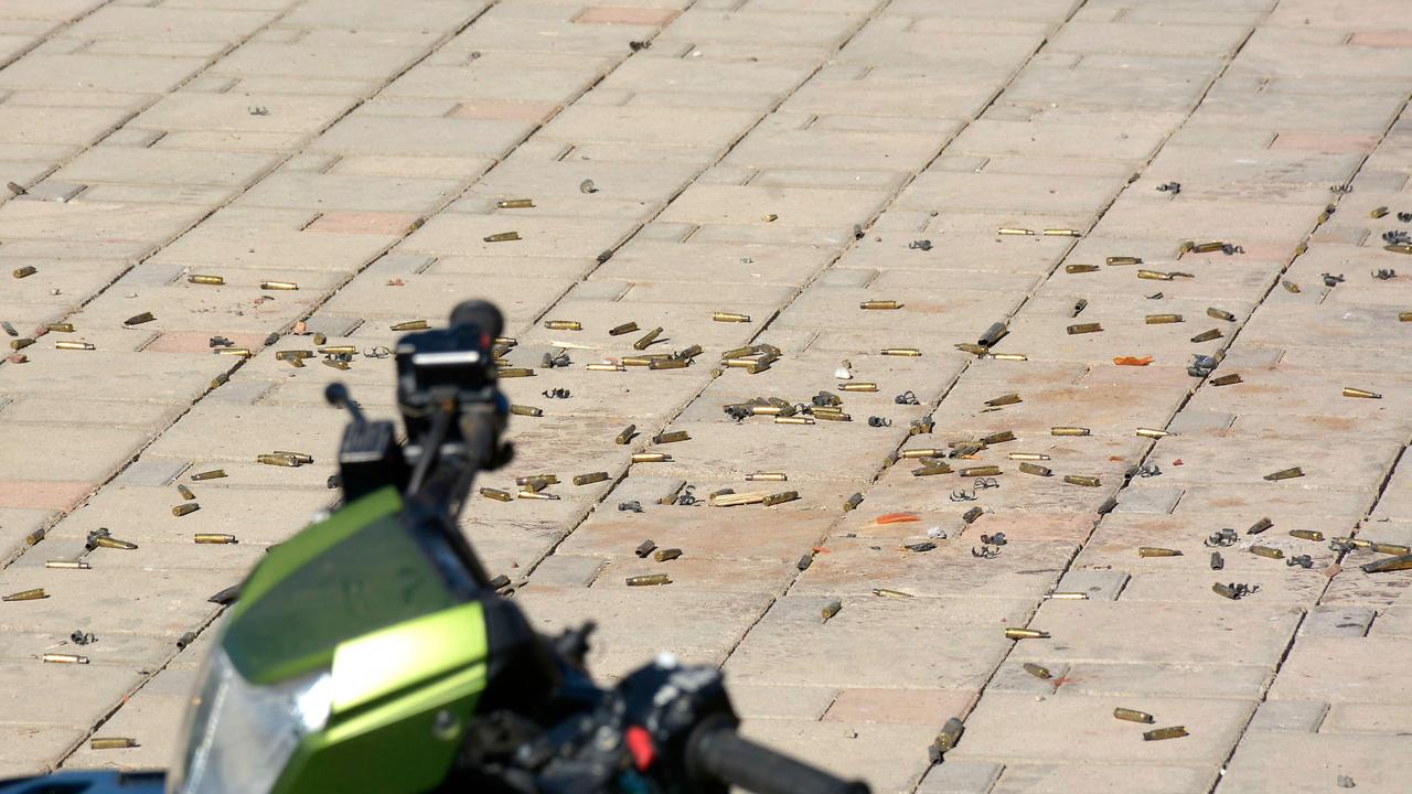 Bullet cases rained over the streets, just days before President Biden is set to visit. Picture: Juan Carlos Cruz / AFP.