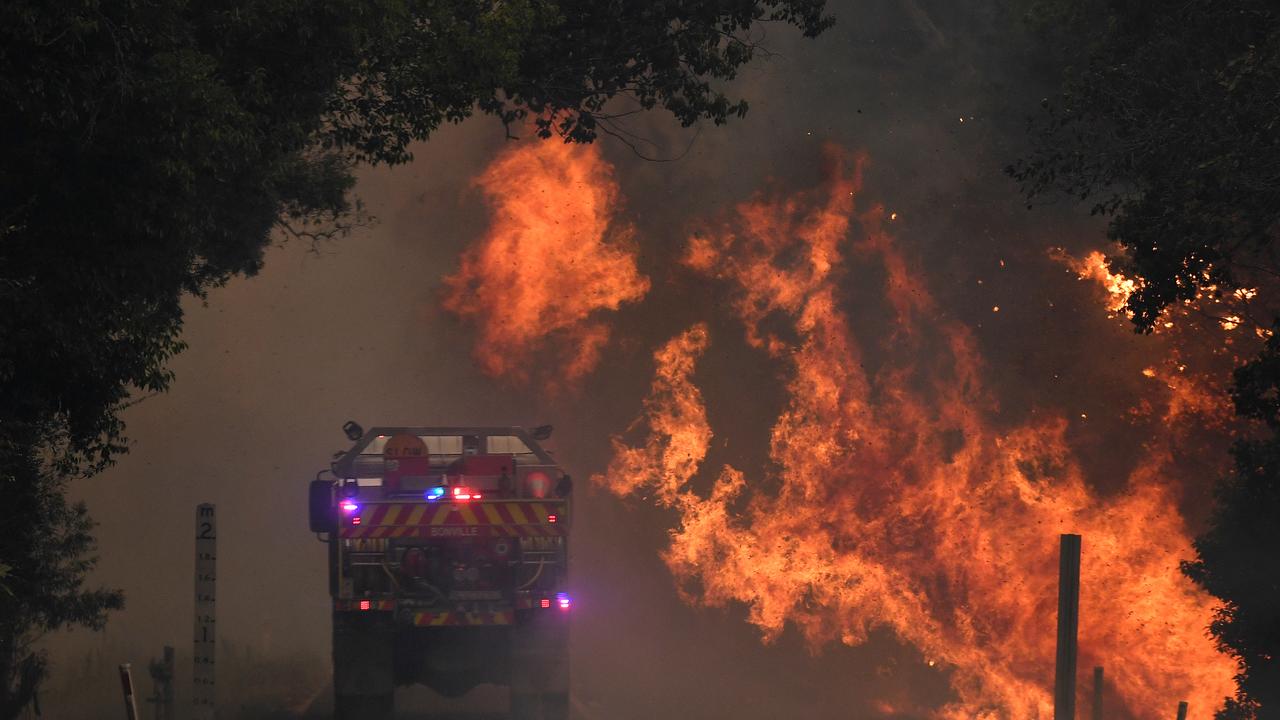 A fire truck is seen near a bushfire in Nana Glen, near Coffs Harbour on Tuesday. Picture: AAP Image/Dan Peled