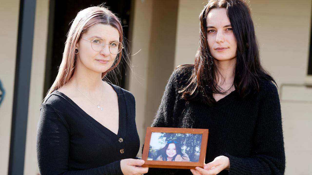 Kimmi Smith and Shen Bell with a photo of Synamin Bell, who was killed by Cody Edwards. Picture: Frank Monger