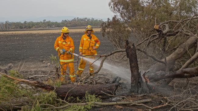 The CFA will be volunteer only under the new Bill. Some CFA volunteers blacking out smouldering trees in Garfield. Picture: Keith Pakenham/AFSM CFA