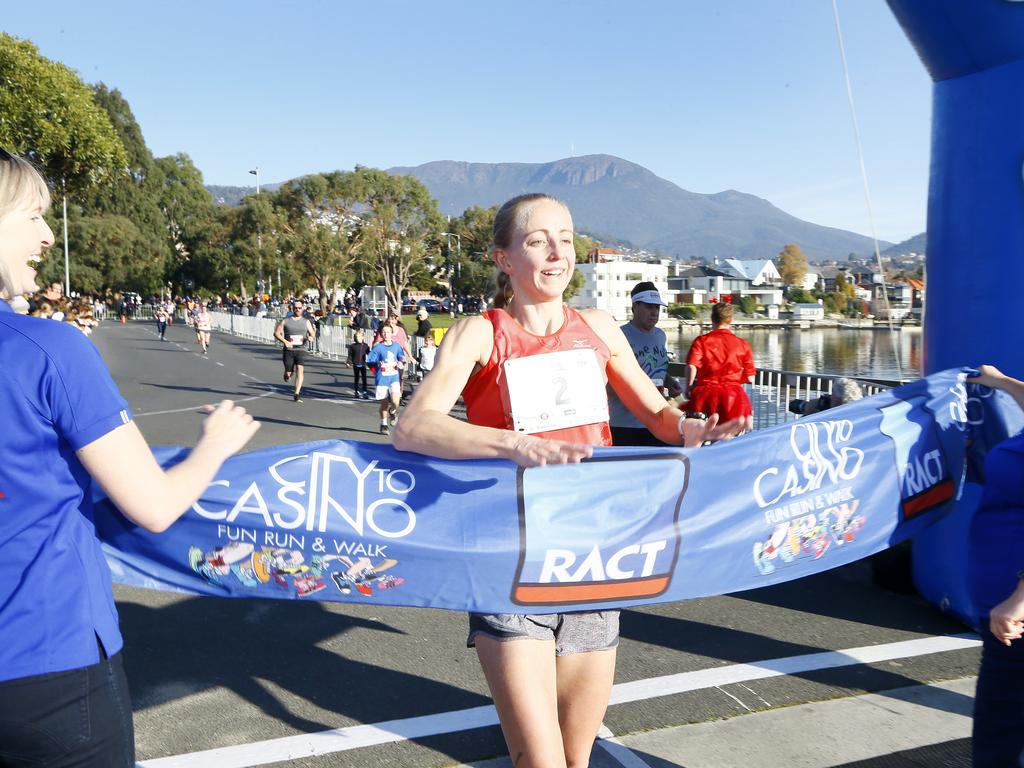 City to Casino Fun Run 2019. (L-R) Mel Daniels crosses the line to win the women's 11km race. Picture: MATT THOMPSON