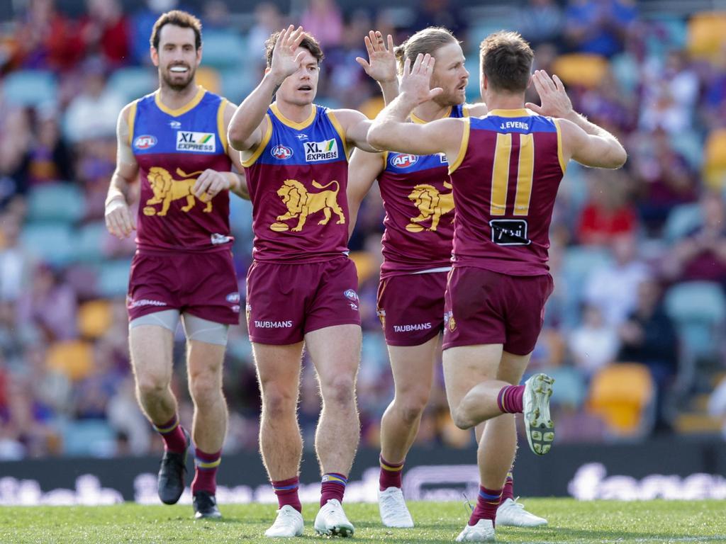 Lachie Neale (centre) celebrates a goal with his Lions teammates in Brisbane’s win over Carlton. Picture: Russell Freeman / AFL Photos via Getty Images