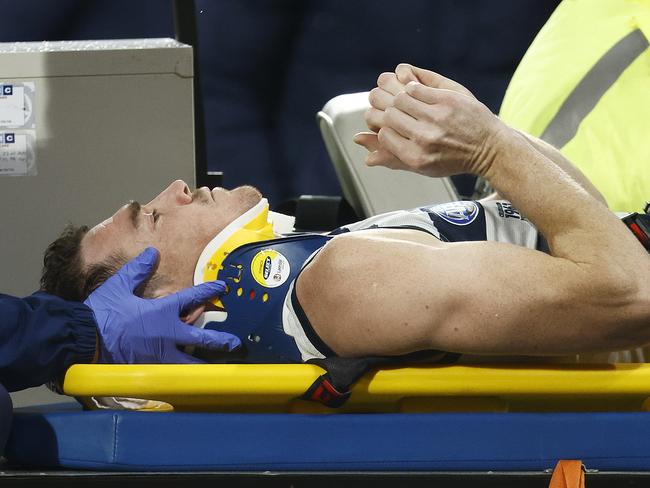 GEELONG, AUSTRALIA - JUNE 22: Jeremy Cameron of the Cats gestures to fans as he is stretchered off the ground during the round 15 AFL match between Geelong Cats and Melbourne Demons at GMHBA Stadium, on June 22, 2023, in Geelong, Australia. (Photo by Daniel Pockett/Getty Images)