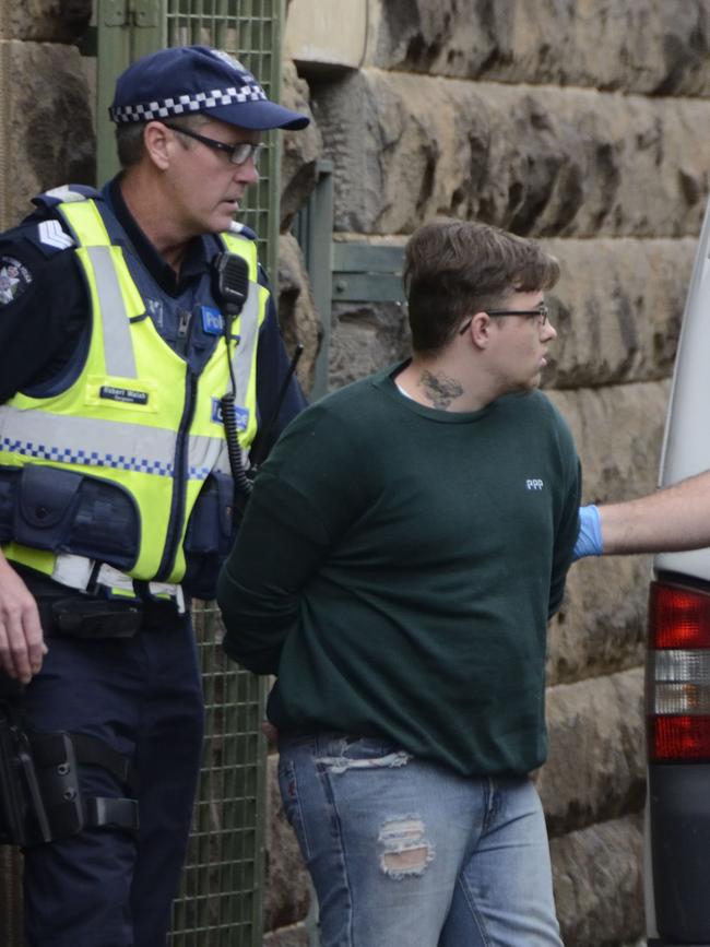 Harley Hicks is escorted by police from court after being sentenced for the murder of 10-month-old Zayden Veal-Whitting. Picture: AAP