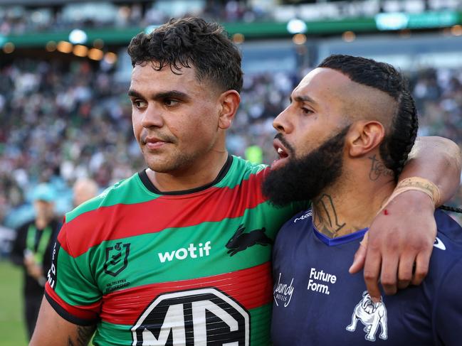 SYDNEY, AUSTRALIA - MARCH 29: Latrell Mitchell of the Rabbitohs and Josh Addo-Carr of the Bulldogs embrace following the round four NRL match between South Sydney Rabbitohs and Canterbury Bulldogs at Accor Stadium, on March 29, 2024, in Sydney, Australia. (Photo by Cameron Spencer/Getty Images)