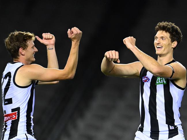 Brody Mihocek is congratulated by Will Hoskin-Elliott after kicking a goal during the round 1 AFL match between the Western Bulldogs and the Collingwood Magpies at Marvel Stadium. Picture: QUINN ROONEY/GETTY IMAGES