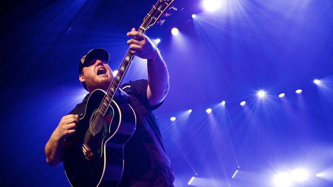 A woman has been charged with selling fake tickets to US country music superstar Luke Combs’ Brisbane concert.