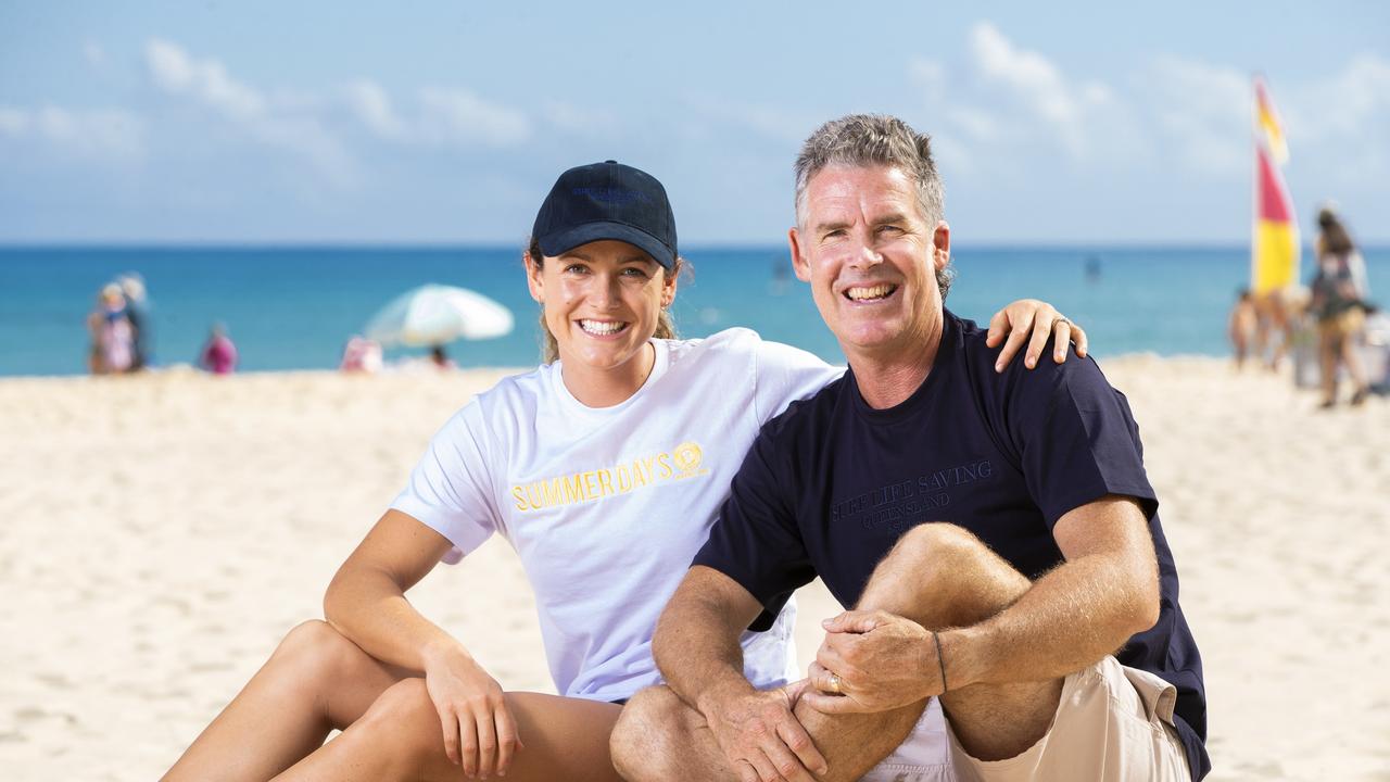 Surf Life Saving champion Jordan Mercer with dad and legend of the sport Darren Mercer on Noosa Main Beach. Picture: Lachie Millard