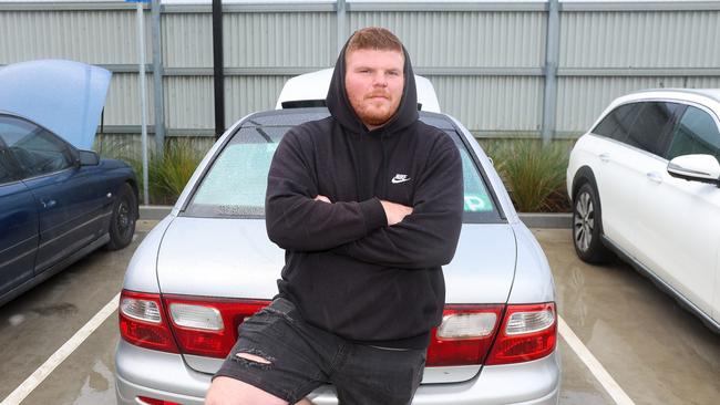 Nick Rodriguez with his defected vehicle after police conducted an inspection. Picture: Brendan Beckett