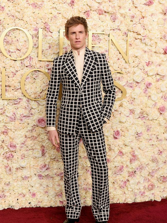 Eddie Redmayne in a black and white plaid Valentino suit. Picture: Getty