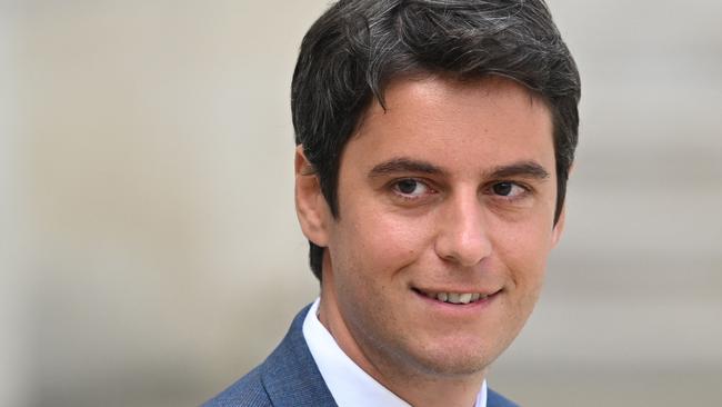 (FILES) Then France's Secretary of State and Government's spokesperson Gabriel Attal leaves after a weekly cabinet meeting at the Elysee Palace in Paris on May 4, 2022. French President Emmanuel Macron on January 9, 2024, named education minister Gabriel Attal as French Prime Minister in a bid to give new momentum to his presidency, with the 34-year-old becoming France's youngest and first openly gay head of government, a source close to the presidency told AFP. (Photo by bertrand GUAY / AFP)