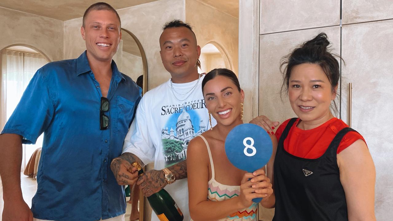 Christopher Shao (second left) with mum Belinda Shao (right) after buying Gold Coast property Ruin X from Matt Jamieson and Emma Sweeny.